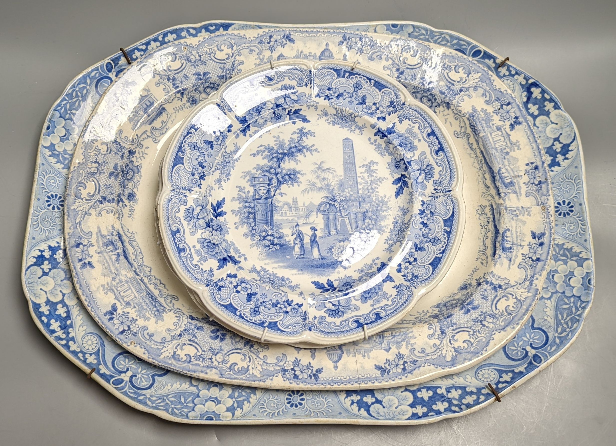 Two 19th century blue and white meat dishes and three similar plates, largest platter 49cms wide